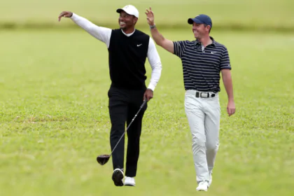 Rory McIlroy is "flattered" as Tiger Woods backs him to win his first Masters and a career grand slam.