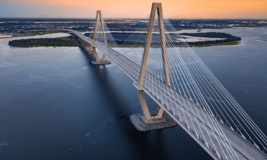 Historic Charleston, SC street with colorful homes and cobblestone path.