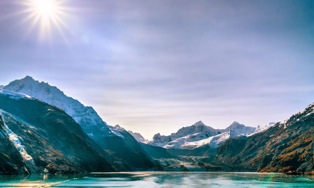 Scenic landscape of Juneau, Alaska with glaciers, mountains, and forest views.