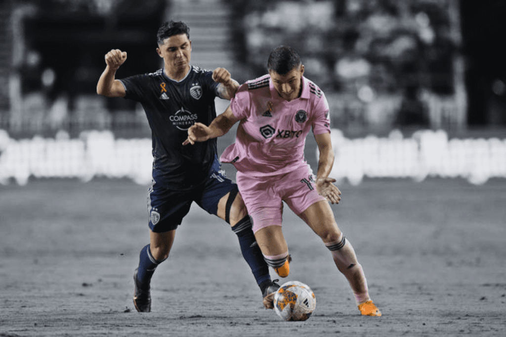 Felipe Gutierrez, a defender for Sporting Kansas City, and Robbie Robinson, a forward for Inter Miami, fight for the ball during the first half of an MLS soccer game in Fort Lauderdale, Florida, on September 9, 2023.
