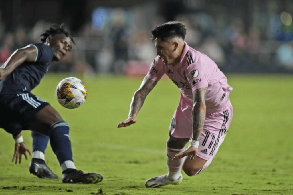 Erik Thommy, a midfielder for Sporting Kansas City, and Facundo Farias, a midfielder for Inter Miami, fight for the ball during the first half of an MLS soccer game in Fort Lauderdale, Florida, on September 9, 2023. 