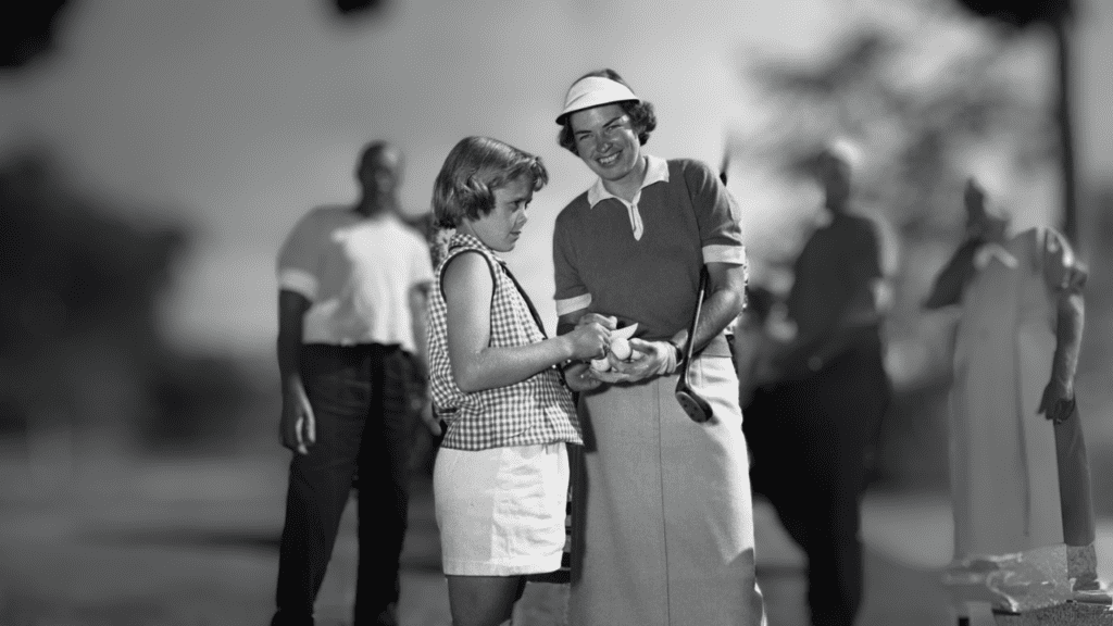 July 2, 1954 Betsy Rawls of Spartanburg, S.C. signs a programme for Janice Gannon, 10, of Lynn, Mass. Following Miss Rawls's second round of the National Women's Open at Salem Country Club in Peabody, Massachusetts, she sig