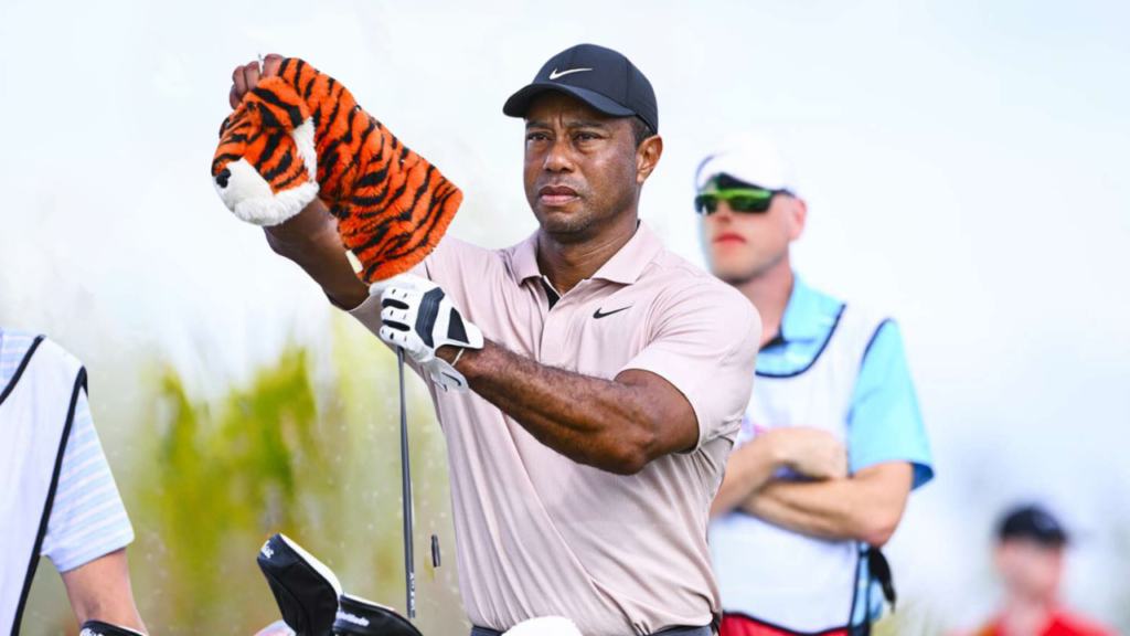 Tiger Woods takes off his "Frank" headcover in the 2023 Hero World Challenge's first round.