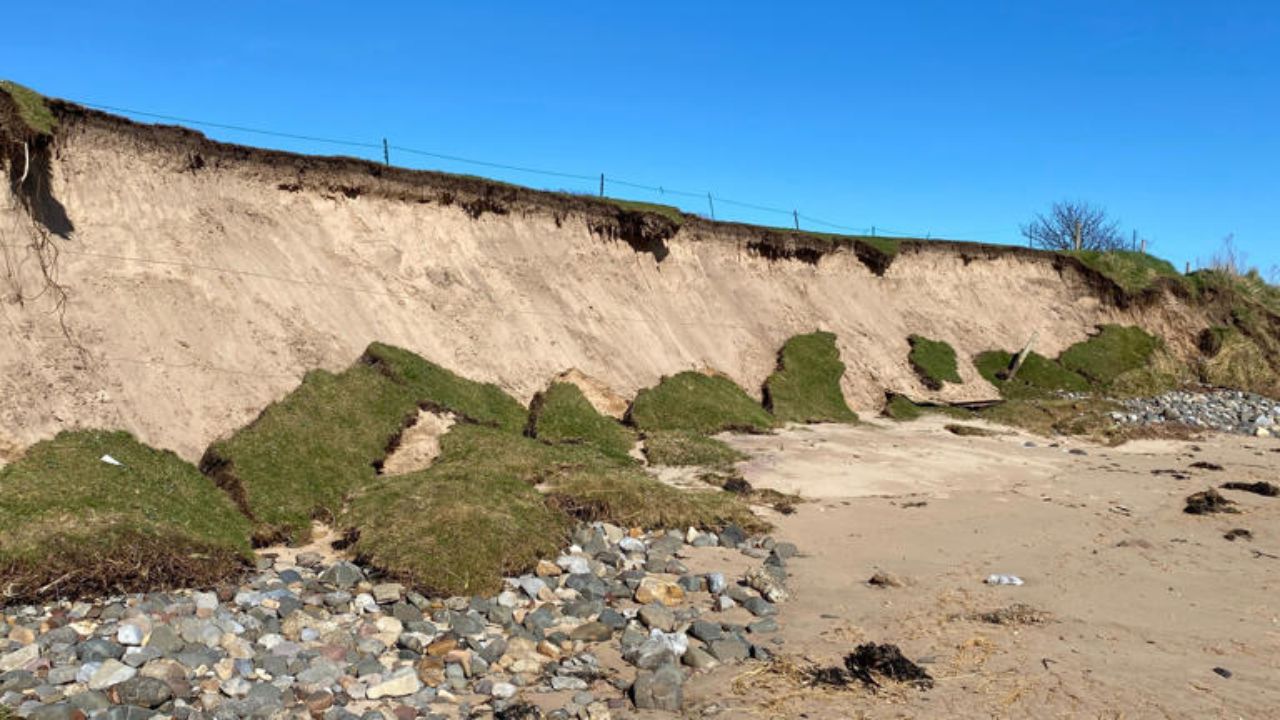 A piece of an old golf course falls into the water. @BBC