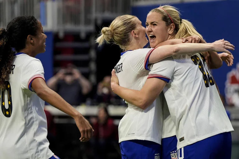 When Lindsey Horan of the United States scores a goal against Japan in the second half of a SheBelieves Cup women's soccer game in Atlanta on April 6, 2024, she celebrates with her friends. The US won by a score of 2-1.
