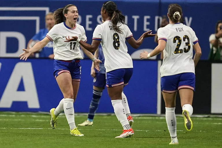 Jaedyn Shaw (8) of the United States celebrates her goal against Japan in the first half of the SheBelieves Cup women's soccer event on Saturday, April 6, 2024, in Atlanta. Sam Coffey (17) set her up. 
