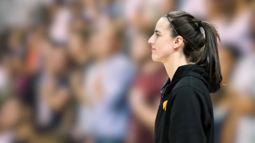 This picture was taken in College Park, Maryland, on February 3, 2024. Caitlin Clark #22 of the Iowa Hawkeyes stands for the national anthem before their game against the Maryland Terrapins at Xfinity Center.
