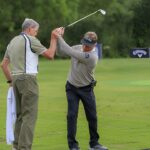 An iconic golf streak nearing its end, with an image of a golf course in the background.