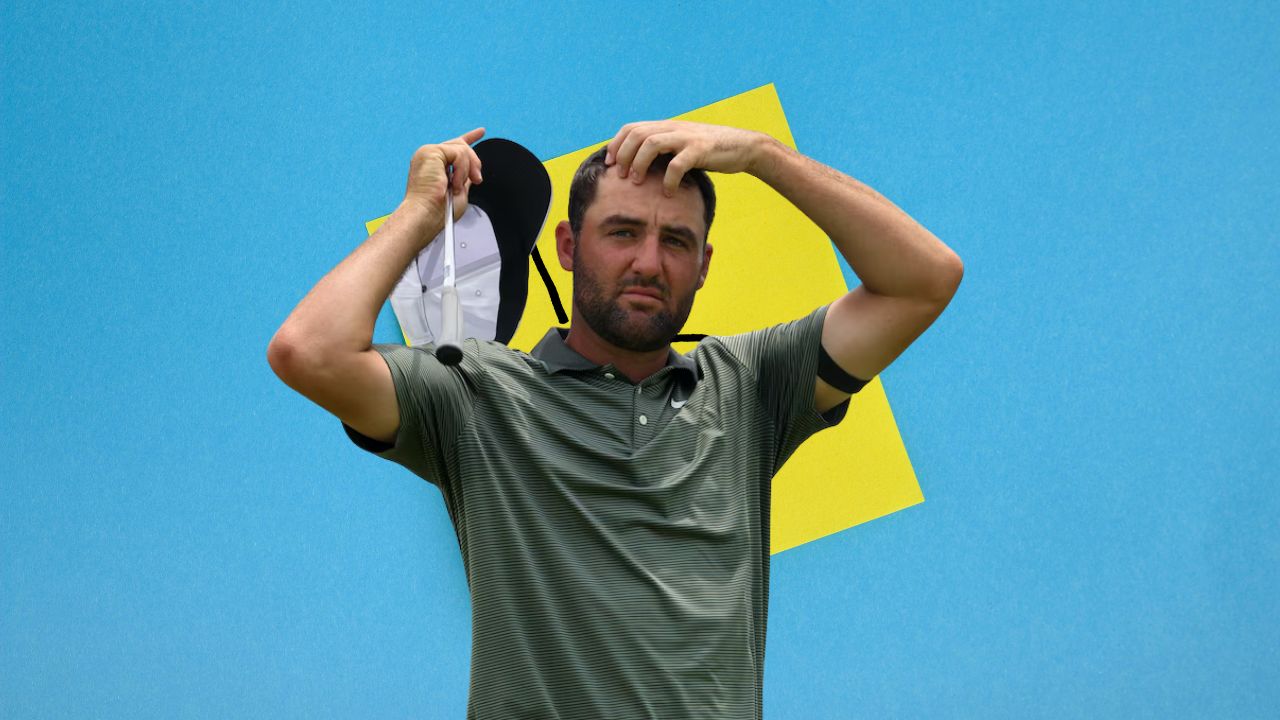 Scottie Scheffler reacting after a difficult shot on a windy and challenging golf course.