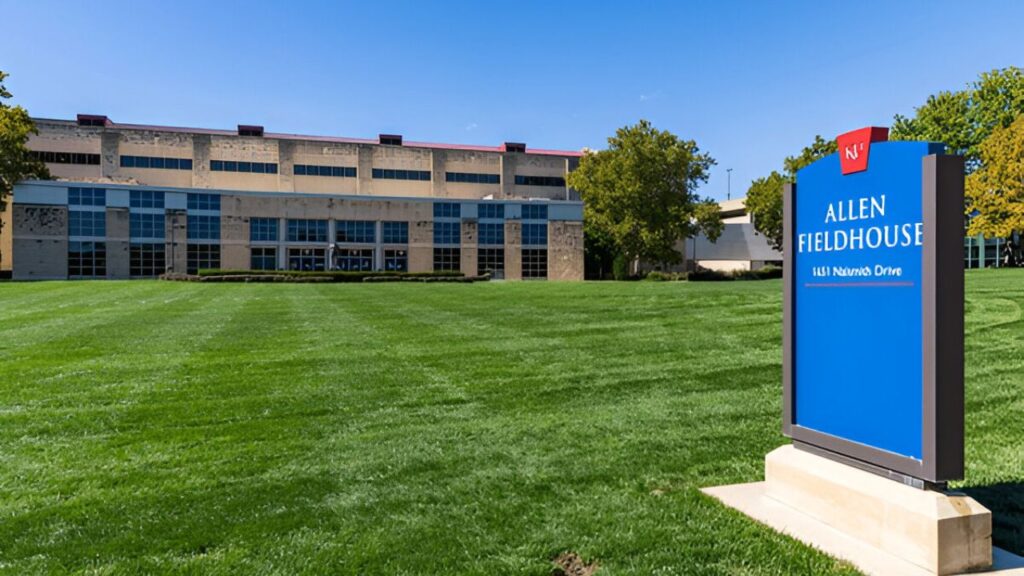 Exterior view of Allen Fieldhouse, the iconic basketball arena at the University of Kansas, known for its historic significance and passionate fanbase.