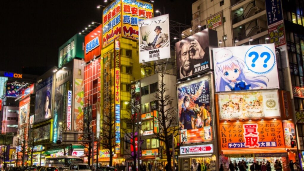 Vibrant skyline of Tokyo featuring Tokyo Tower and the bustling Shibuya Crossing.