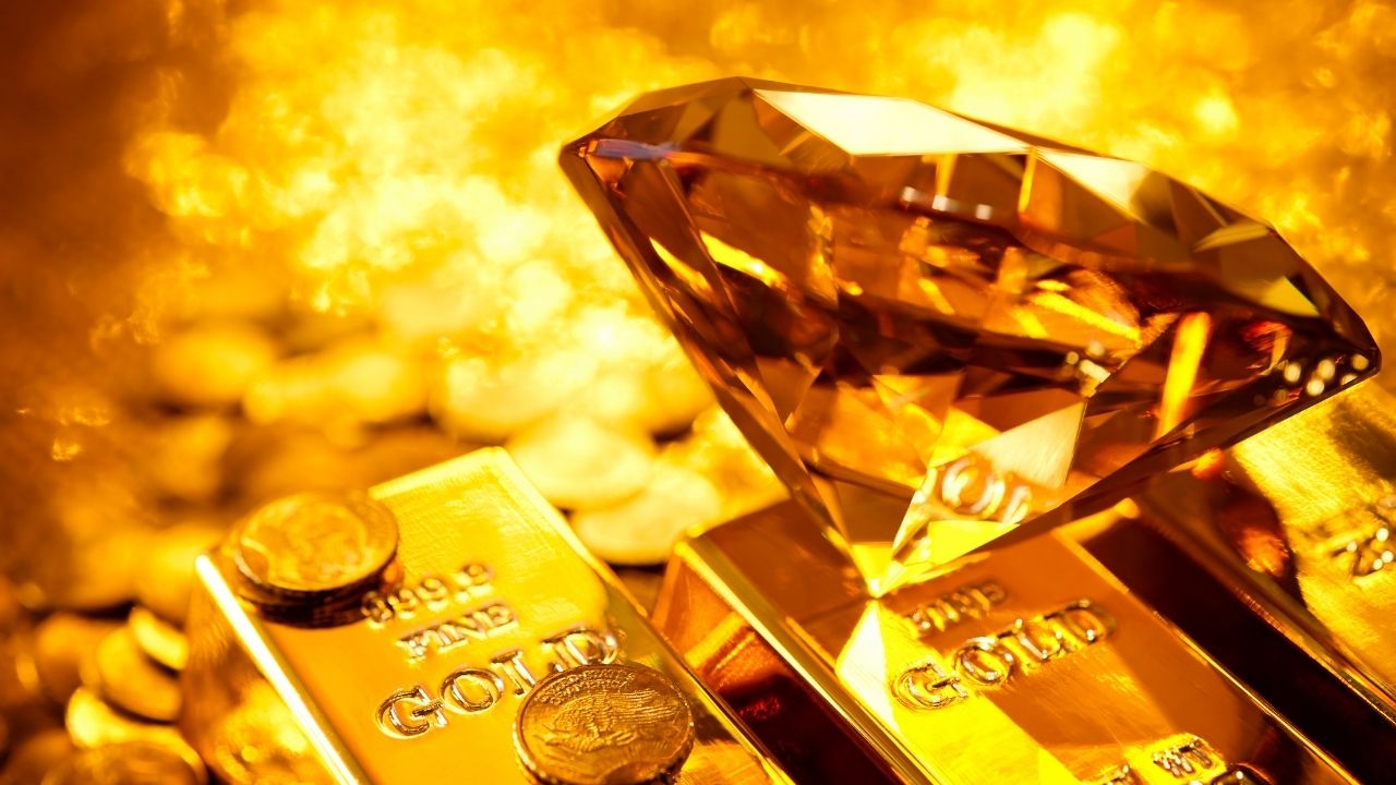Gold bars stacked neatly, representing expert advice on how much gold to buy every year for a balanced investment portfolio.
