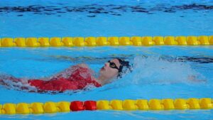 Summer McIntosh in mid-swim, breaking the 10-year-old world record in the 200-meter individual medley at the Canadian Swimming Trials