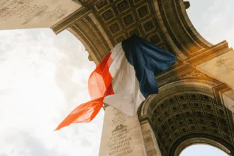 France marks Bastille Day with pomp, a salute to India, and more cops to stop new trouble.