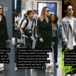 Angelina Jolie looks stylish in a black trench coat and white pants at JFK Airport. She rented a building in Manhattan that Andy Warhol once owned.
