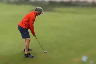 American man sinks a putt that is 401.2 feet long, breaking the Guinness World Record for the longest golf putt ever.