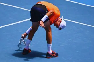 Medvedev fights off cramps and tears as he beats the brutal heat at the Australian Open
